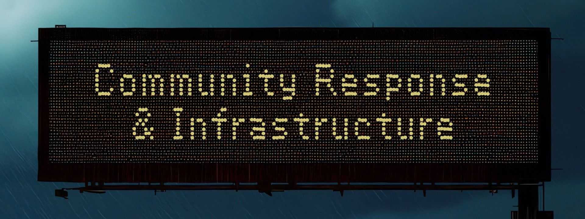 Electronic highway sign in rainy conditions reads “Community Response & Infrastructure" with blurred traffic and lights below in a stormy scene.